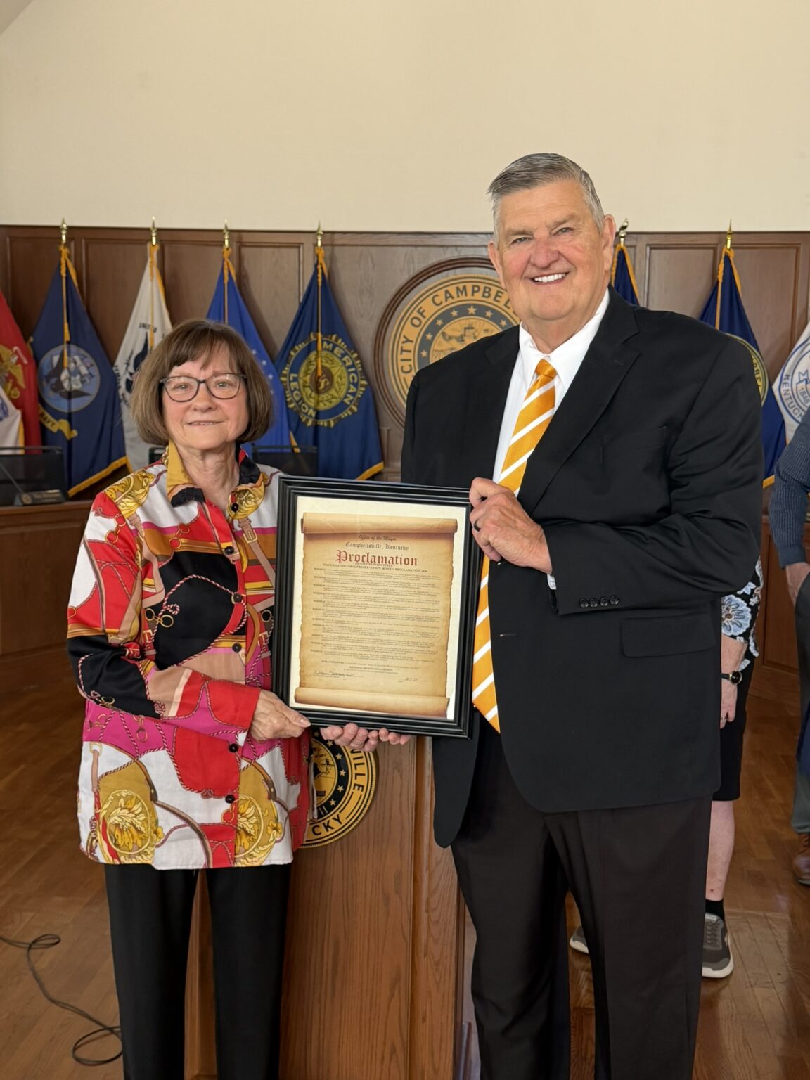 Mayor Benningfield presenting the Historic Preservation Month proclamation